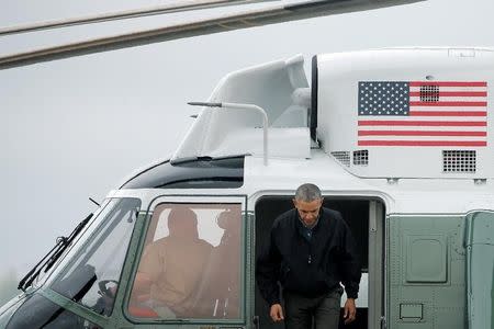 U.S. President Barack Obama arrives to board Air Force One for travel to Vietnam and Japan from Joint Base Andrews, Maryland, U.S. May 21, 2016. REUTERS/Carlos Barria