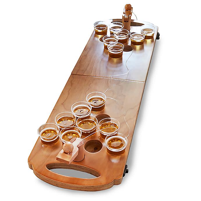 <br><br><strong>Polished</strong> HammerAxe Wooden Mini Beer Pong Set, $, available at <a href="https://go.skimresources.com/?id=30283X879131&url=https%3A%2F%2Fwww.bedbathandbeyond.com%2Fstore%2Fproduct%2Fhammeraxe-wooden-mini-beer-pong-set%2F5207749%3FcategoryId%3D13873" rel="nofollow noopener" target="_blank" data-ylk="slk:Bed Bath and Beyond" class="link rapid-noclick-resp">Bed Bath and Beyond</a>