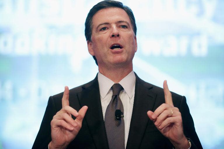 Federal Bureau of Investigation Director James Comey addresses the Intelligence and National Security Summit on September 19, 2014 in Washington, DC