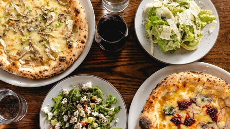 Jay's Artisan pizza with wine and salad