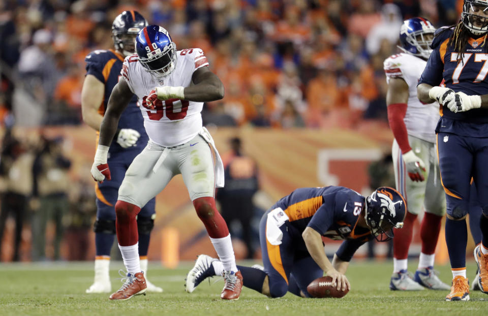 New York Giants defensive end Jason Pierre-Paul (90) reacts after sacking Denver Broncos quarterback Trevor Siemian. (AP)