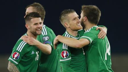 Football - Northern Ireland v Greece - UEFA Euro 2016 Qualifying Group F - Windsor Park, Belfast, Northern Ireland - 8/10/15 Northern Ireland's Steven Davis celebrates with team mates at the end of the match Action Images via Reuters / Jason Cairnduff Livepic