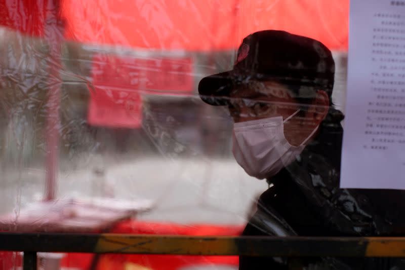 A man wearing face mask is seen in Qibao, an old river town on the outskirts of Shanghai