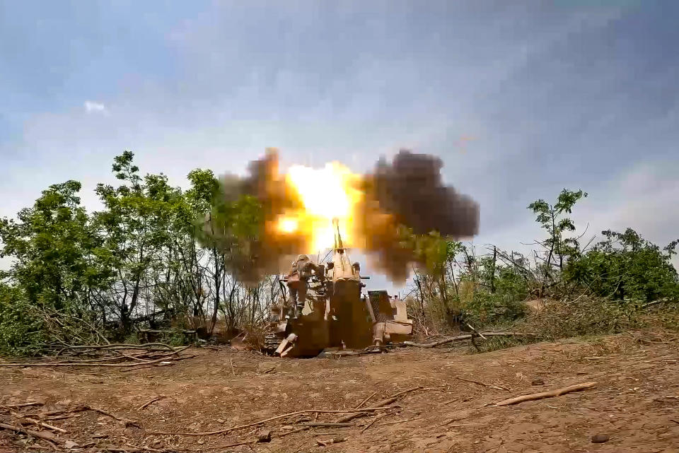 In this photo taken from video released by the Russian Defense Ministry Press Service on Tuesday, Aug. 8, 2023, a Russian howitzer fires toward Ukrainian positions at an undisclosed location. (Russian Defense Ministry Press Service via AP)