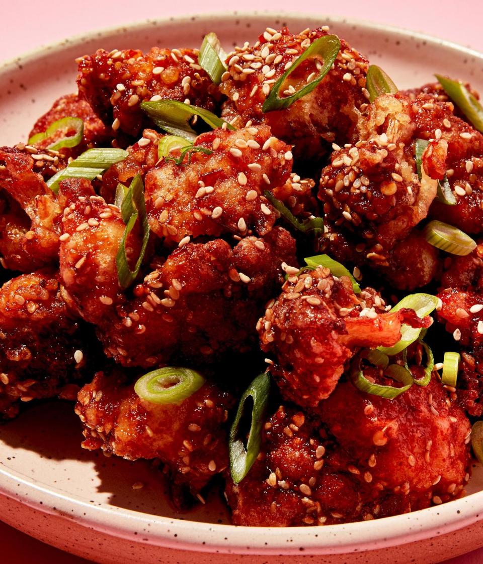 <p>This recipe was <em>very </em>loosely inspired by our <a href="https://www.delish.com/cooking/recipe-ideas/a26089644/korean-fried-chicken-recipe/" rel="nofollow noopener" target="_blank" data-ylk="slk:Korean fried chicken wings;elm:context_link;itc:0;sec:content-canvas" class="link ">Korean fried chicken wings</a>, but nothing about this recipe is really traditional at all. The cauliflower florets are battered in a <a href="https://www.delish.com/cooking/recipe-ideas/a31750708/tempura-batter-recipe/" rel="nofollow noopener" target="_blank" data-ylk="slk:tempura;elm:context_link;itc:0;sec:content-canvas" class="link ">tempura</a>-like batter, which does aid in a wing-like crispy coating, but you're still going to want to eat these right away—the crunch factor diminishes quickly!</p><p>Get the <strong><a href="https://www.delish.com/cooking/recipe-ideas/recipes/a58295/korean-fried-cauliflower-recipe/" rel="nofollow noopener" target="_blank" data-ylk="slk:Chili Garlic Fried Cauliflower recipe;elm:context_link;itc:0;sec:content-canvas" class="link ">Chili Garlic Fried Cauliflower recipe</a></strong>.</p>