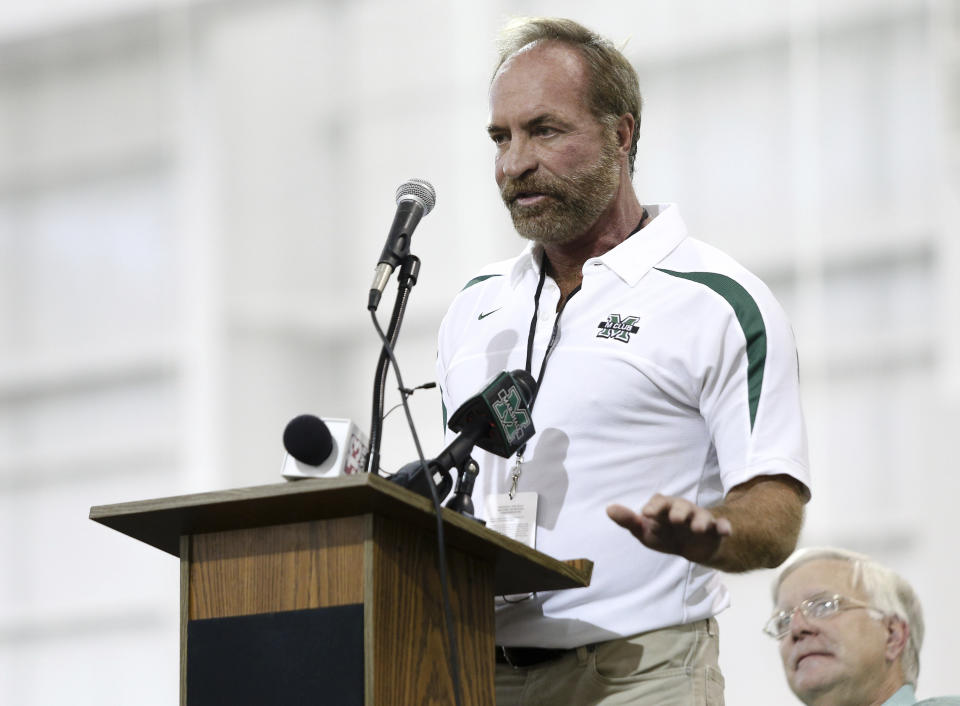 In this Sept. 6, 2014 photo, Chris Cline speaks as Marshall University dedicates the new indoor practice facility as the Chris Cline Athletic Complex in Huntington, W.Va. Police in the Bahamas say a helicopter flying from Big Grand Cay island to Fort Lauderdale has crashed, killing seven Americans on board. None of the bodies recovered from the downed helicopter have been identified, but police Supt. Shanta Knowles told The Associated Press on Friday, July 5, 2019, that the missing-aircraft report from Florida said billionaire Chris Cline was on board. (Sholten Singer/The Herald-Dispatch via AP)