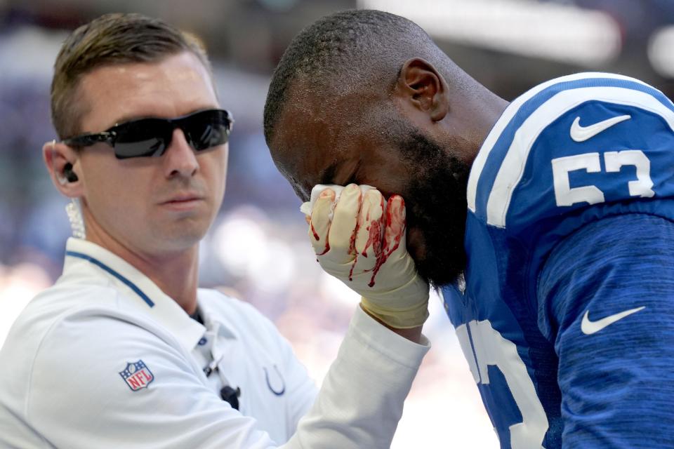 Training staff tends to Indianapolis Colts linebacker Shaquille Leonard (53) on Sunday, Oct. 2, 2022, during a game against the Tennessee Titans at Lucas Oil Stadium in Indianapolis.