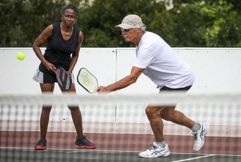 Tina Hayes and Norris Townsend team up to play a doubles pickleball match in North Myrtle Beach on Tuesday. Pickleball, invented in 1965, is considered America’s fastest growing sport, according to a 2022 report by the Sports and Fitness Industry Association. October 17, 2022.