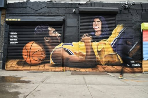 A mural in Brooklyn, New York, shows late basketball superstar Kobe Bryant and his daughter Gianna; both died in a helicopter crash along with seven other people