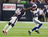<p>T.Y. Hilton #13 of the Indianapolis Colts catches a pass that was almost intercepted by Kareem Jackson #25 of the Houston Texans during the third quarter during the Wild Card Round at NRG Stadium on January 5, 2019 in Houston, Texas. (Photo by Bob Levey/Getty Images) </p>