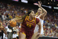 Iowa State center Audi Crooks (55) drives past Texas forward Taylor Jones (44) during the first half of an NCAA college basketball game for the Big 12 tournament championship Tuesday, March 12, 2024, in Kansas City, Mo. (AP Photo/Charlie Riedel)