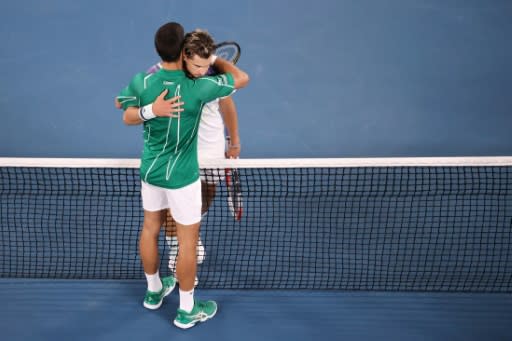 Serbia's Novak Djokovic embraces Austria's Dominic Thiem after their final