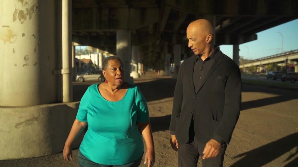 PHOTO: Amy Stelly and Nightline anchor Bryon Pitts walk beneath the Claiborne Avenue Expressway. (ABC News)