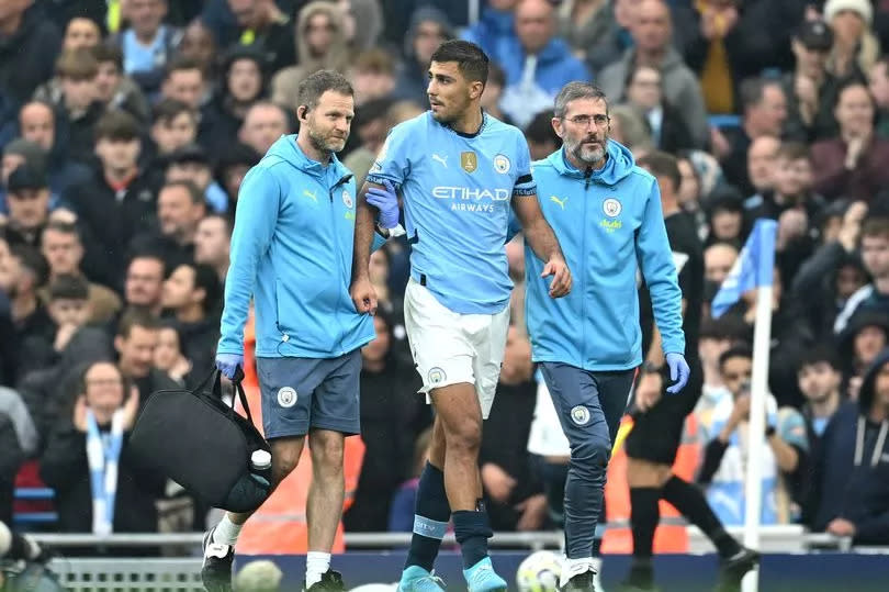 Rodri of Manchester City leaves the pitch following an injury during the Premier League match between Manchester City FC and Arsenal FC at Etihad Stadium on September 22, 2024