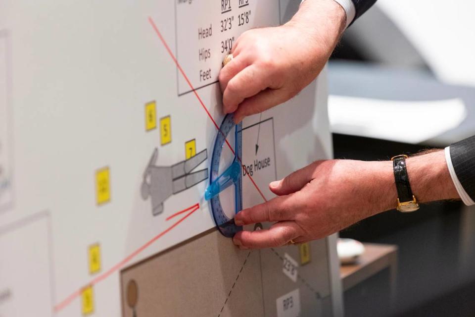 Melinda Worley, SLED foot and tire tread expert, helped modify a crime scene diagram to show possible bullet trajectory with defense attorney Dick Harpootlian during Alex Murdaugh’s trial for murder at the Colleton County Courthouse on Monday, Jan. 30, 2023. Joshua Boucher/The State/Pool