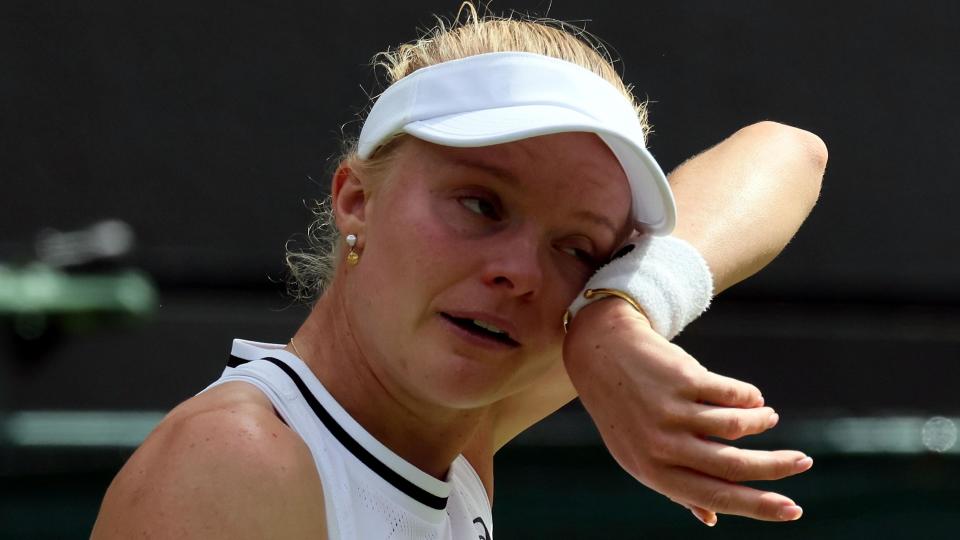 Harriet Dart wipes away tears with her sweatband during her Wimbledon second round match against Katie Boulter