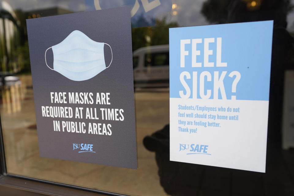 Face mask requirements following CDC guidance are posted at the various entrances at the Rose E. McCoy Auditorium where COVID-19 vaccinations are being offered in Jackson, Miss., on July 27, 2021. (Photo by Rogelio V. Solis, AP)