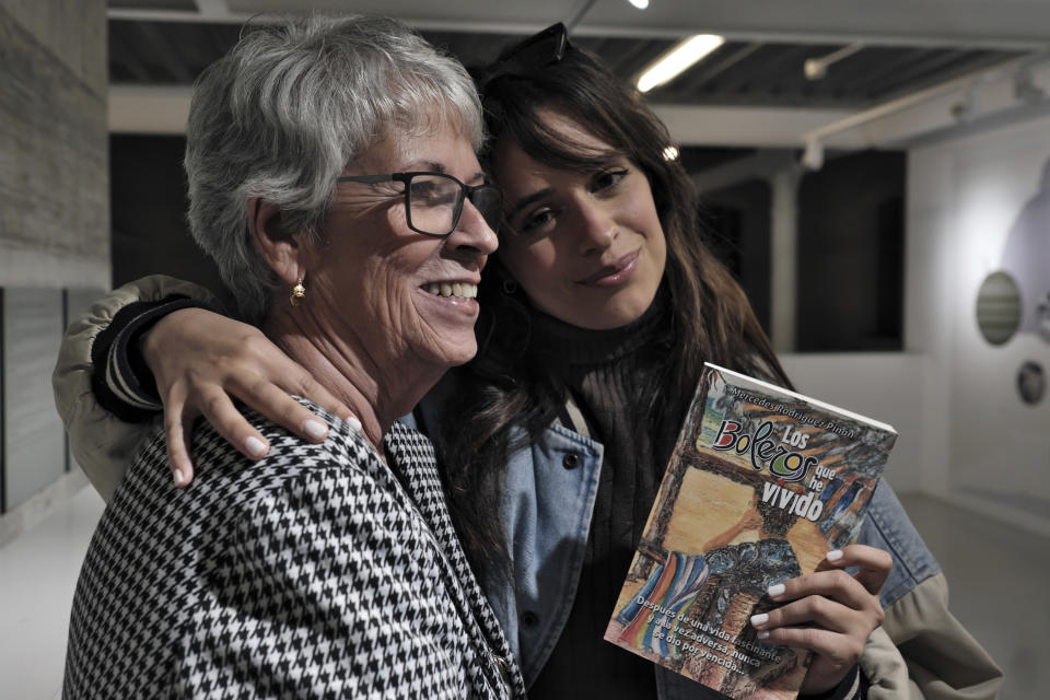 Cuban-born American singer and songwriter Camila Cabello, right, poses with her grandmother, Mercedes Rodriguez, during and interview for the Associated Press in Malaga, Spain, Thursday, March 23, 2023. When she's not singing or dancing, Cabello likes to support members of her family such as Rodriguez, who has recently published her debut novel in Spanish titled "Los boleros que he vivido". (AP Photo/Gregorio Marrero)