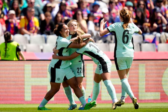 Chelsea’s Erin Cuthbert, (second left) celebrates with her team-mates after scoring at Barcelona