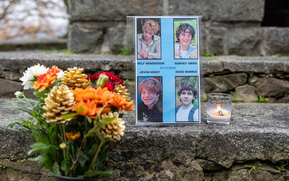 Floral tributes in Garreg left in the memory of the four teenagers from Shrewsbury who were killed when their car left the road near the village in Snowdonia