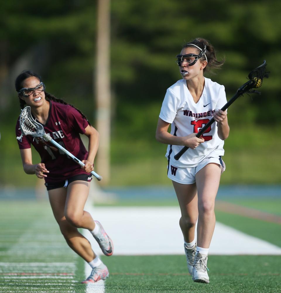 Wappingers' Alexa Cazzorla draws away from Ossining's Ella Nee during a Section 1 girls lacrosse Class A quarterfinal on May 19, 2023.