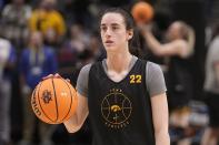 Iowa's Caitlin Clark dribbles during a practice session for an NCAA Women's Final Four semifinals basketball game Thursday, March 30, 2023, in Dallas. (AP Photo/Darron Cummings)