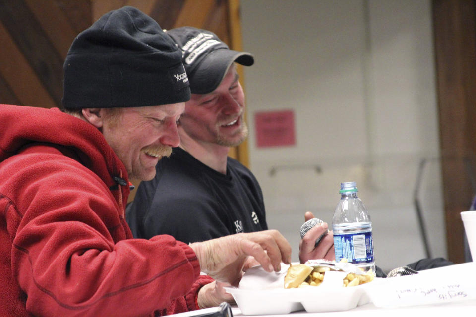 FILE - In this March 15, 2016, file photo, Mitch Seavey, left, and Dallas Seavey speak to fans after the Iditarod Trail Sled Dog Race in Nome, Alaska. Mitch Seavey had a commanding two-hour lead Tuesday, March 14, 2017, in the 2017 Iditarod, and was nearing the finish line. If the lead holds, he and his son, Dallas, will have won the last six sled dog races across nearly a thousand miles of grueling Alaska wilderness. (AP Photo/Mark Thiessen, File)