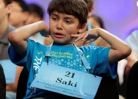 Sakiusa Meador, 8, of Marbleton, Wyoming, stretches as he wait his turn during the 2017 Scripps National Spelling Bee at National Harbor in Oxon Hill, Maryland, U.S., May 31, 2017. REUTERS/Joshua Roberts