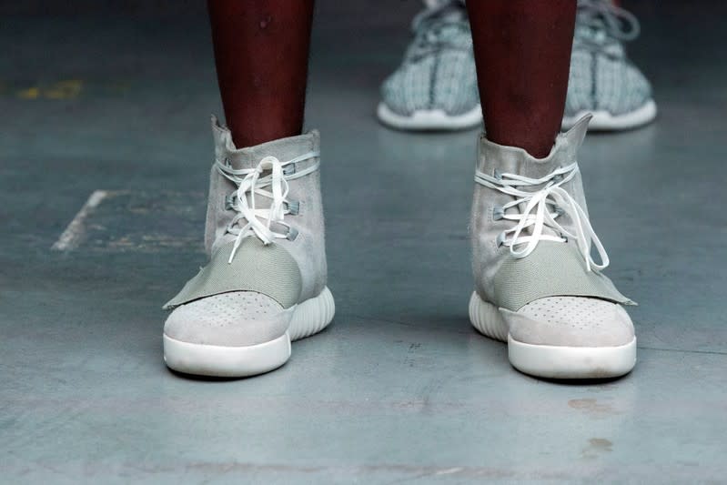 FILE PHOTO: A model wears a pair of Adidas Yeezy 750 Boost shoes designed by Kanye West as part of his Fall/Winter 2015 partnership line with Adidas at New York Fashion Week