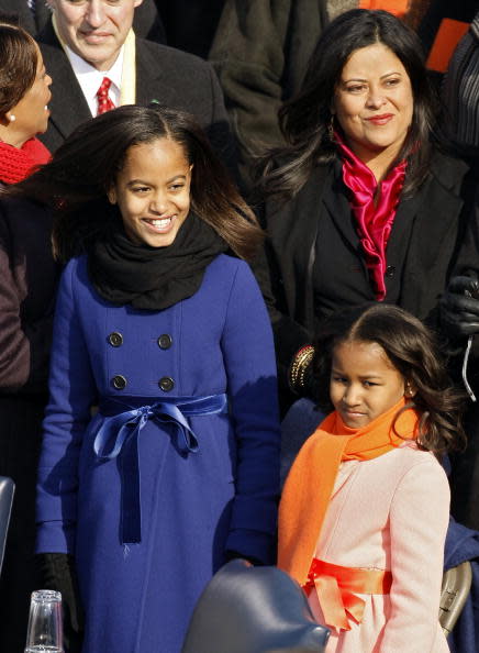 Malia and Sasha Obamam stand on the stage ahead of the inauguration of Barack Obama as the 44th President of the United States of America on the West Front of the Capitol January 20, 2009 in Washington, DC. Obama becomes the first African-American to be elected to the office of President in the history of the United States. (Photo by Chip Somodevilla/Getty Images)