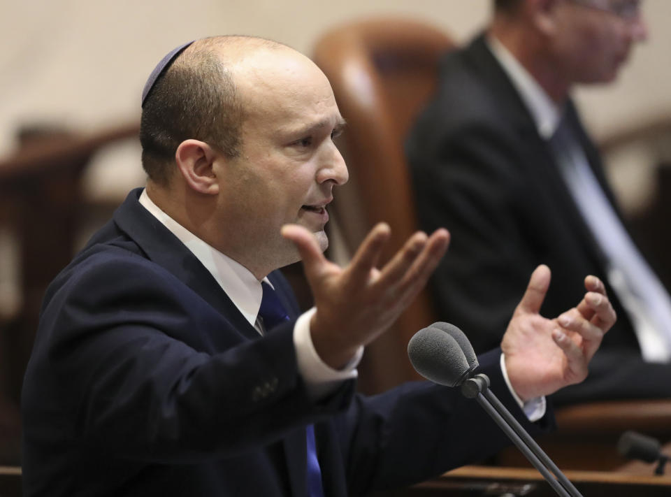 Israel's designated new prime minister, Naftali Bennett speaks during a Knesset session in Jerusalem Sunday, June 13, 2021. Bennett is expected later Sunday to be sworn in as the country's new prime minister, ending Prime Minister Benjamin Netanyahu's 12-year rule. (AP Photo/Ariel Schali22