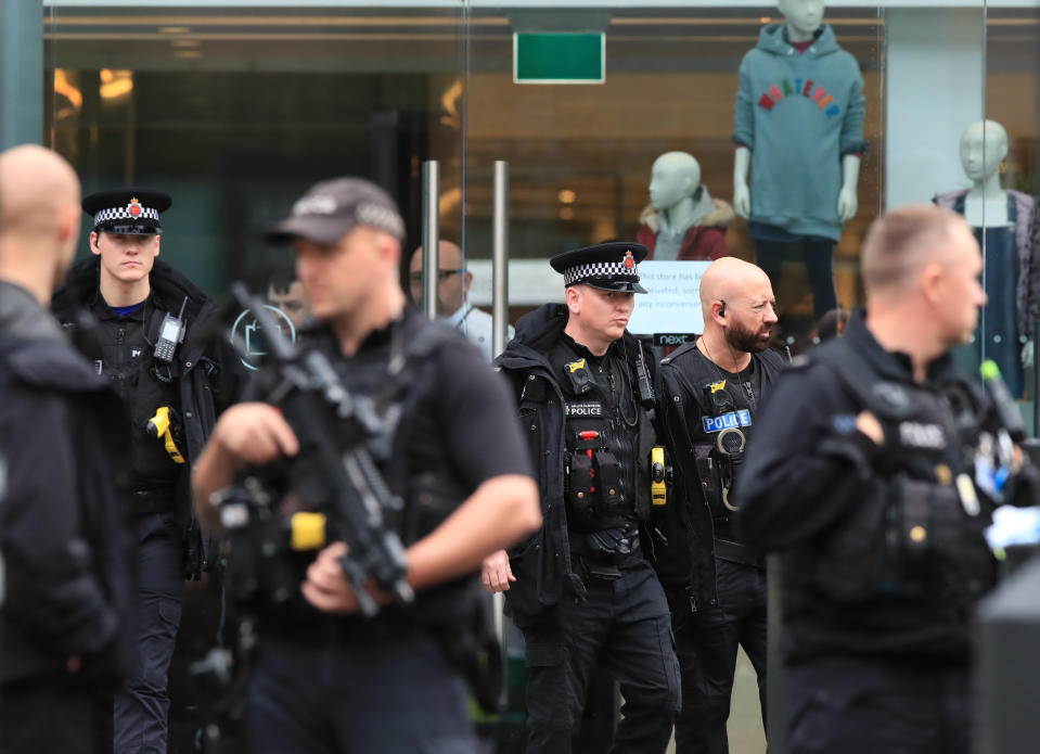 Armed police officers outside the Arndale Centre in Manchester where at least five people have been treated after a stabbing incident.