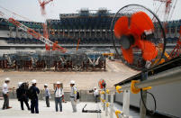 <p>Electrical fans are seen during a heat wave, at the construction site of the New National Stadium, the main stadium of the Tokyo 2020 Olympics and Paralympics, during a media opportunity in Tokyo, Japan July 18, 2018. (Photo: Issei Kato/Reuters) </p>