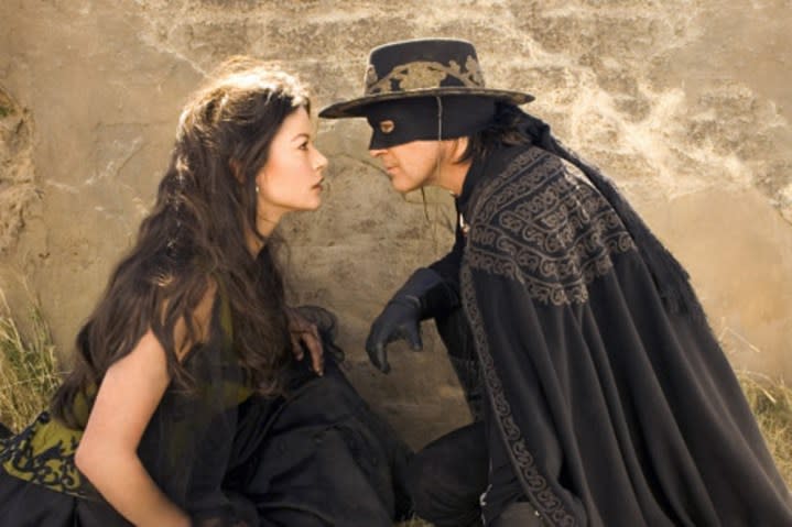 A man and a woman look at each other in The Legend of Zorro.