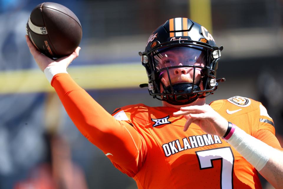 Oklahoma State's Alan Bowman (7) warms up before college football action between the Oklahoma State University Cowboys and the Utah Utes at Boone Pickens Stadium in Stillwater, Oklahoma, Saturday, Sept. 21, 2024.