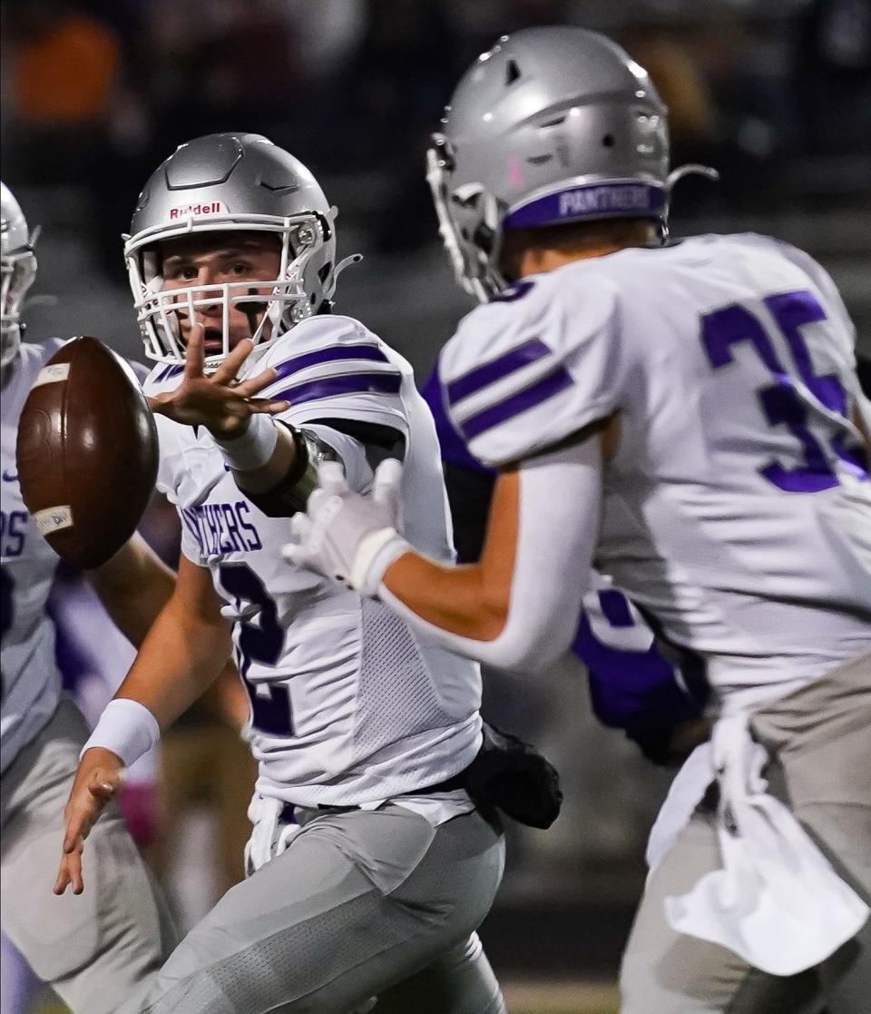 Bloomington South’s Jarrin Alley (12) pitches the ball to Gavin Adams (35) during the IHSAA sectional championship football game at Seymour on Friday, Nov. 3, 2023.