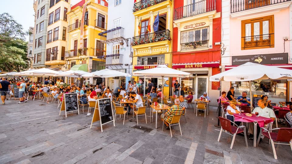 Spain offers one of the lowest costs of living in Western Europe. And the outdoor cafe scene in Valencia certainly has appeal. - RossHelen/iStock Editorial/Getty Images