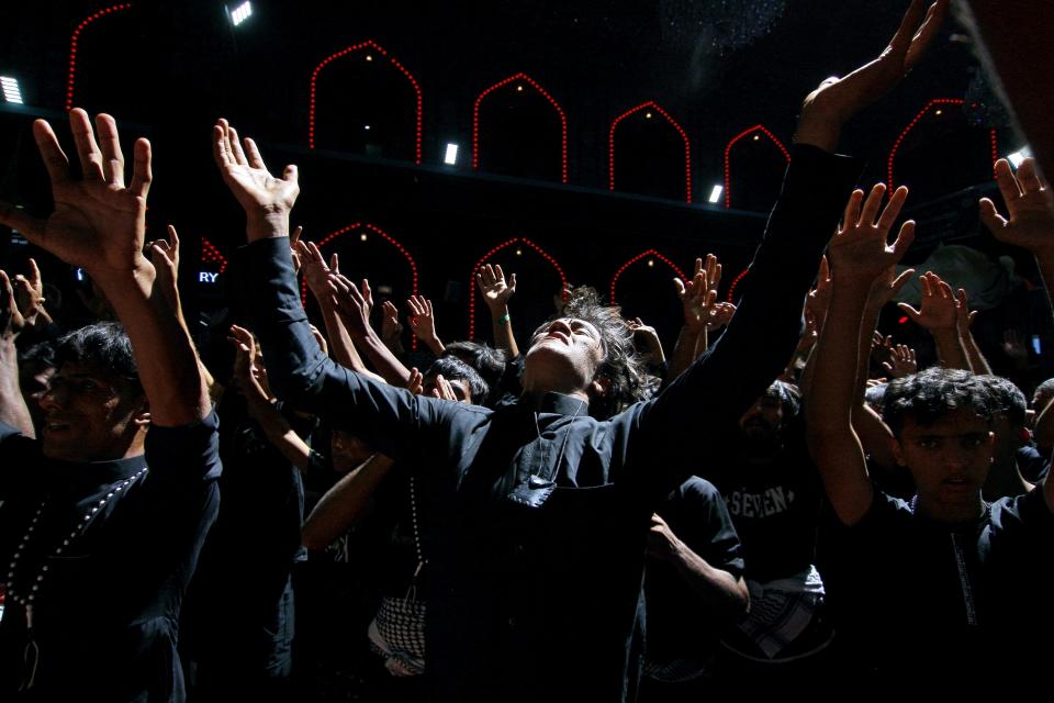 FILE - Shiite Muslim worshippers gather inside the holy shrine of Imam Hussein on the Arbaeen Shiite festival in Karbala, Iraq, Monday, Sept. 27, 2021. In the Middle East and North Africa, where religion is often ingrained in daily life's very fabric, rejecting faith can come with social or other repercussions, so many of the "nones," a group that includes agnostics, atheists and "nothing in particular" conceal that part of themselves, as blasphemy laws and policies are widespread in the region. (AP Photo/Anmar Khalil, File)