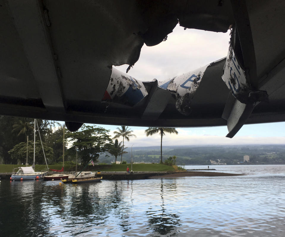 The damage left to the roof of the tour boat by the ‘lava bomb’. Source: AP