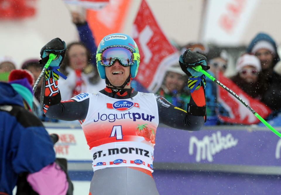 Ted Ligety of the Unites States celebrates in the finish area after winning an alpine ski men's World Cup giant slalom in St. Moritz, , Switzerland, Sunday, Feb. 2, 2014. (AP Photo/Pier Marco Tacca)