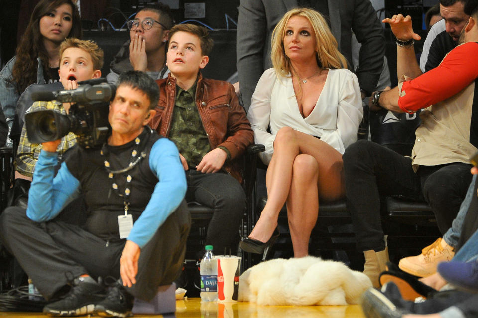 Britney Spears attends a basketball game with sons Sean Federline and Jayden James Federline in 2017. / Credit: Allen Berezovsky via Getty Images
