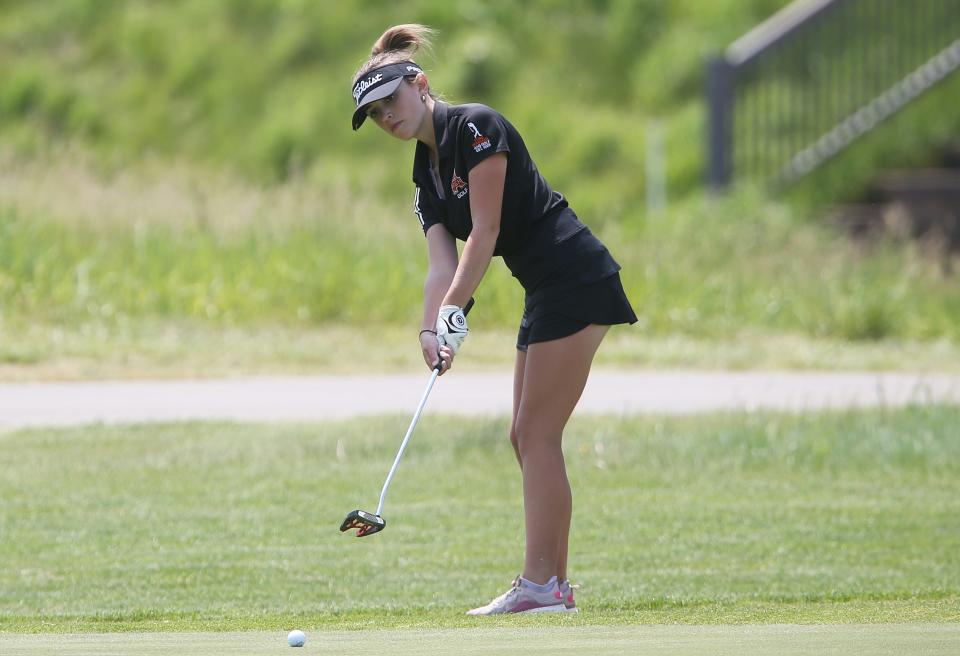 Ames'  Elizabeth Duncan putts the ball onto the 9th holein the class 4A girls'  state golf tournament first round at Otter Creek Golf Course on Thursday, May 25, 2023, in Ankeny, Iowa.