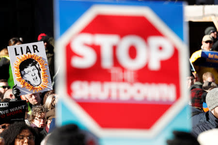 U.S. federal government workers and other demonstrators march during a “Rally to End the Shutdown” in Washington, U.S., January 10, 2019. REUTERS/Kevin Lamarque