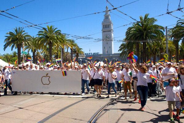 Photo of Apple's workers participating in the 2014 Pride parade 