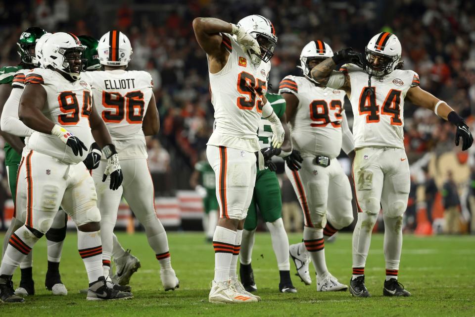 Cleveland Browns defensive end Myles Garrett (95) reacts after sacking New York Jets quarterback Trevor Siemian (14) on Thursday in Cleveland.
