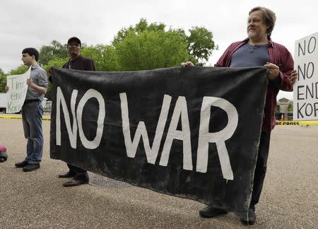 Activists from "the Popular Resistance" and "people opposed to war with North Korea" hold a protest in front of the White House. REUTERS/Kevin Lamarque