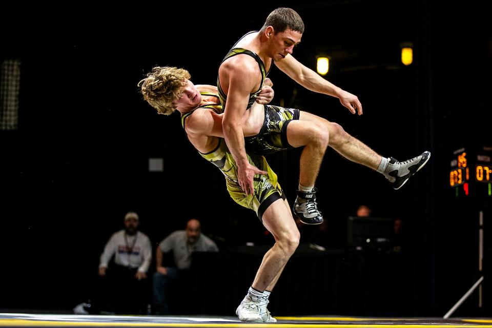 Casey Swiderski, left, wrestled Jesse Mendez during the RUDIS Super Match 1 in March. He could be a factor in Iowa State's starting lineup as a true freshman during the 2022-23 season.