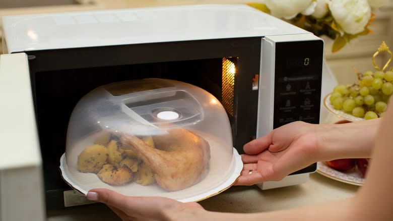 Food going into a microwave