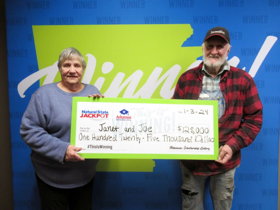 Janet Russenberger and Joe Castor with the $125,000 prize they will share from the Arkansas Scholarship Lottery, Jan. 3, 2024 (courtesy ASL)