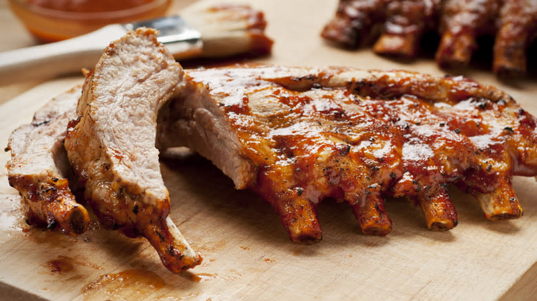 Ribs with sauce on cutting board